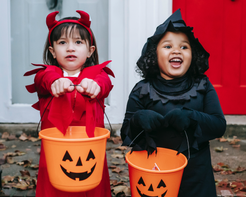 toddlers dressed up for halloween